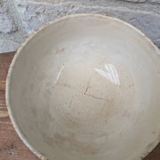 Old opaque porcelain bowl from Gien with a floral decoration.