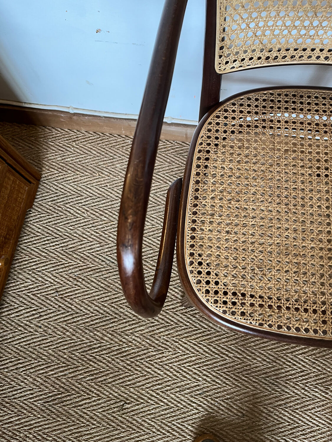 Curved wood and cane armchair