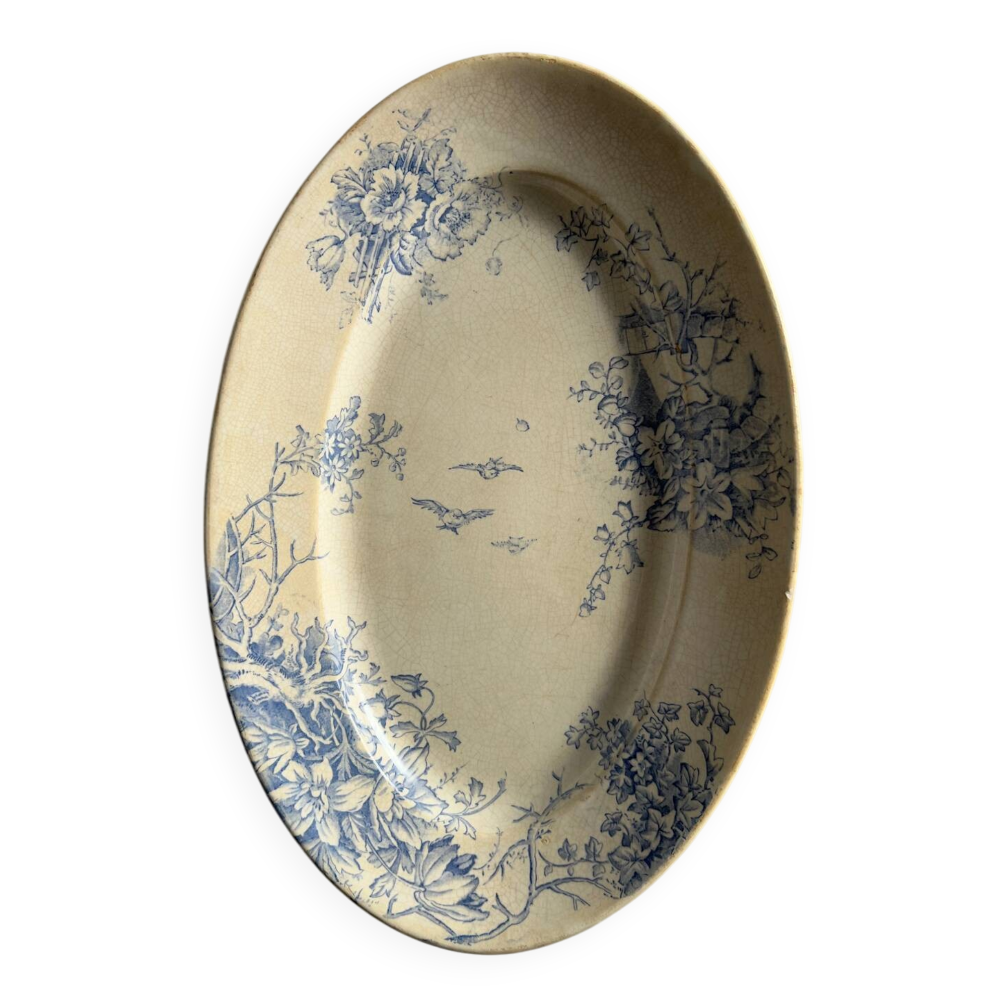Oval blue presentation plate with birds.