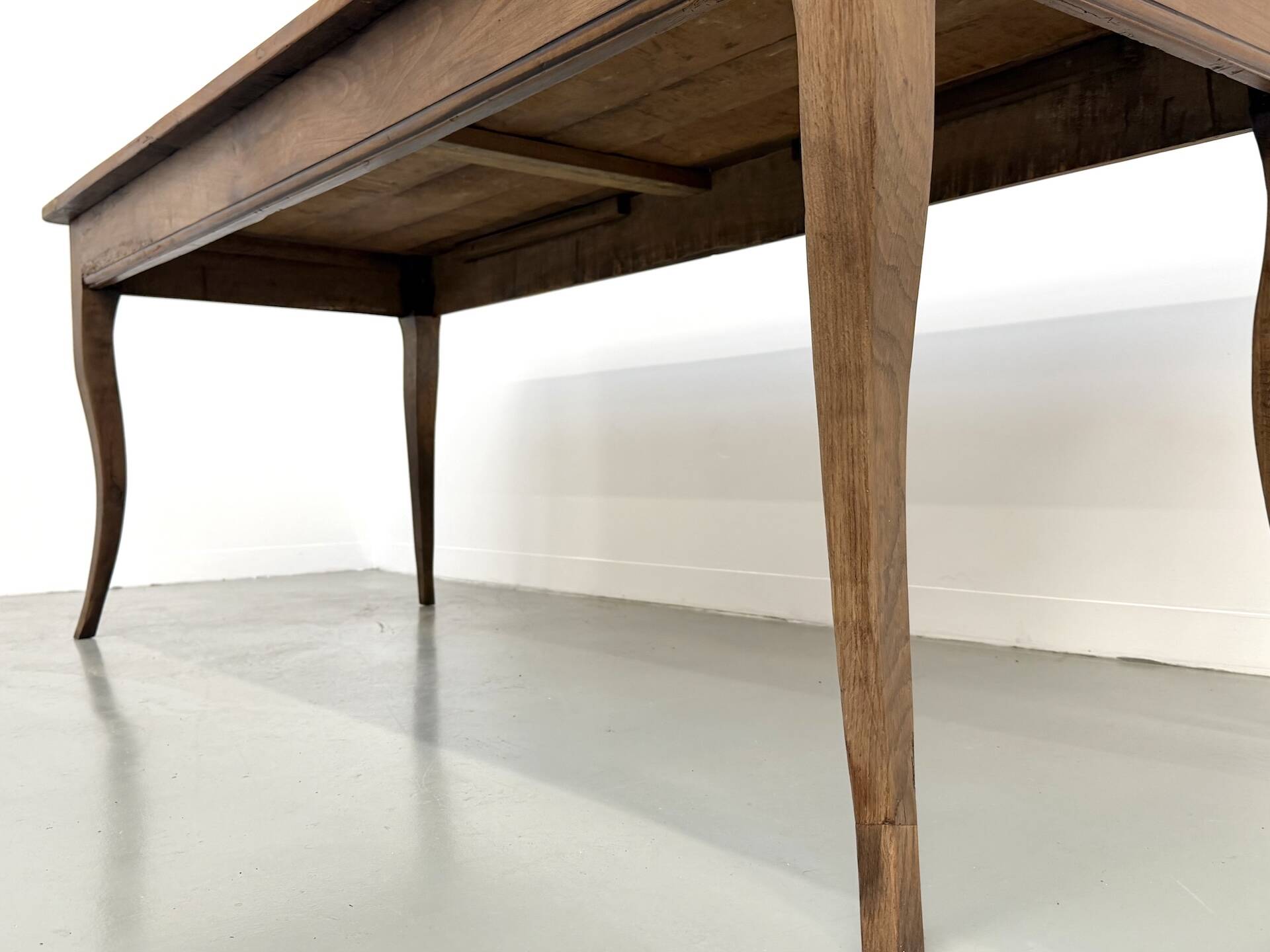 Farm table in solid cherry — Saber legs, Circa 1880