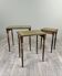 Suite de 3 tables gigognes en bois et cuir vert, XXe Siècle