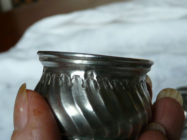 Pair of silver pepper shaker punch minerve