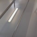 Vintage oval dining table in smoked glass and chrome metal, Space Age style.