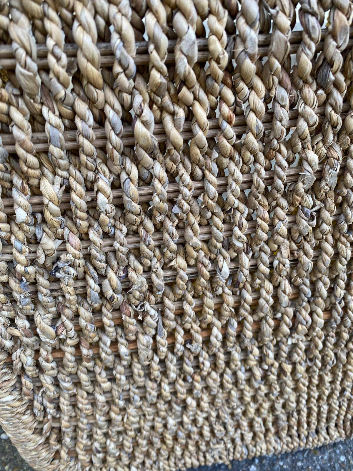 Large basket / rectangular storage bin made of woven natural fibre.