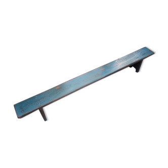 Low bench rests feet in patinated wood