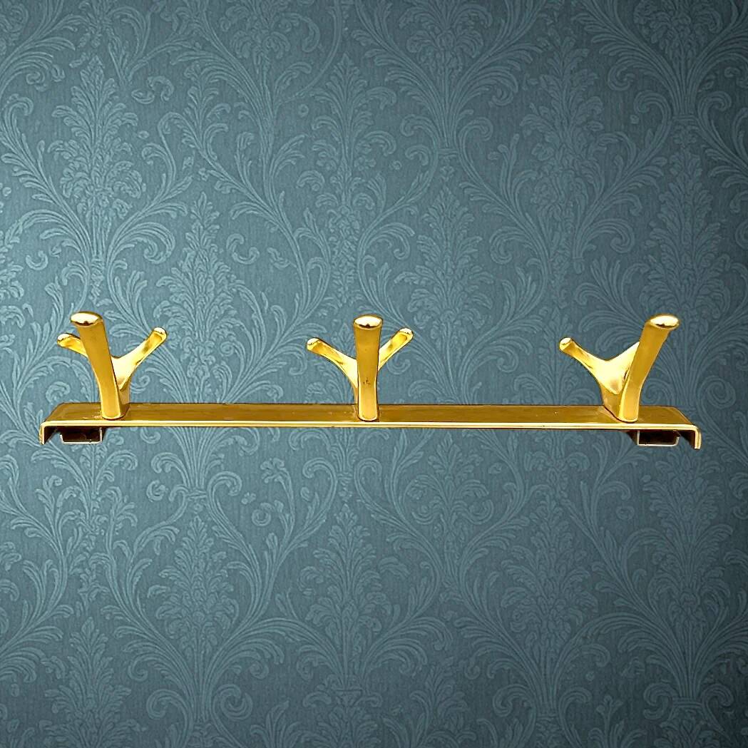 Vintage wall-mounted coat rack in anodised gold aluminium with 3 hooks from the 1970s.