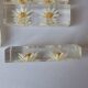 12 knife rests with resin inclusion. 1970s.