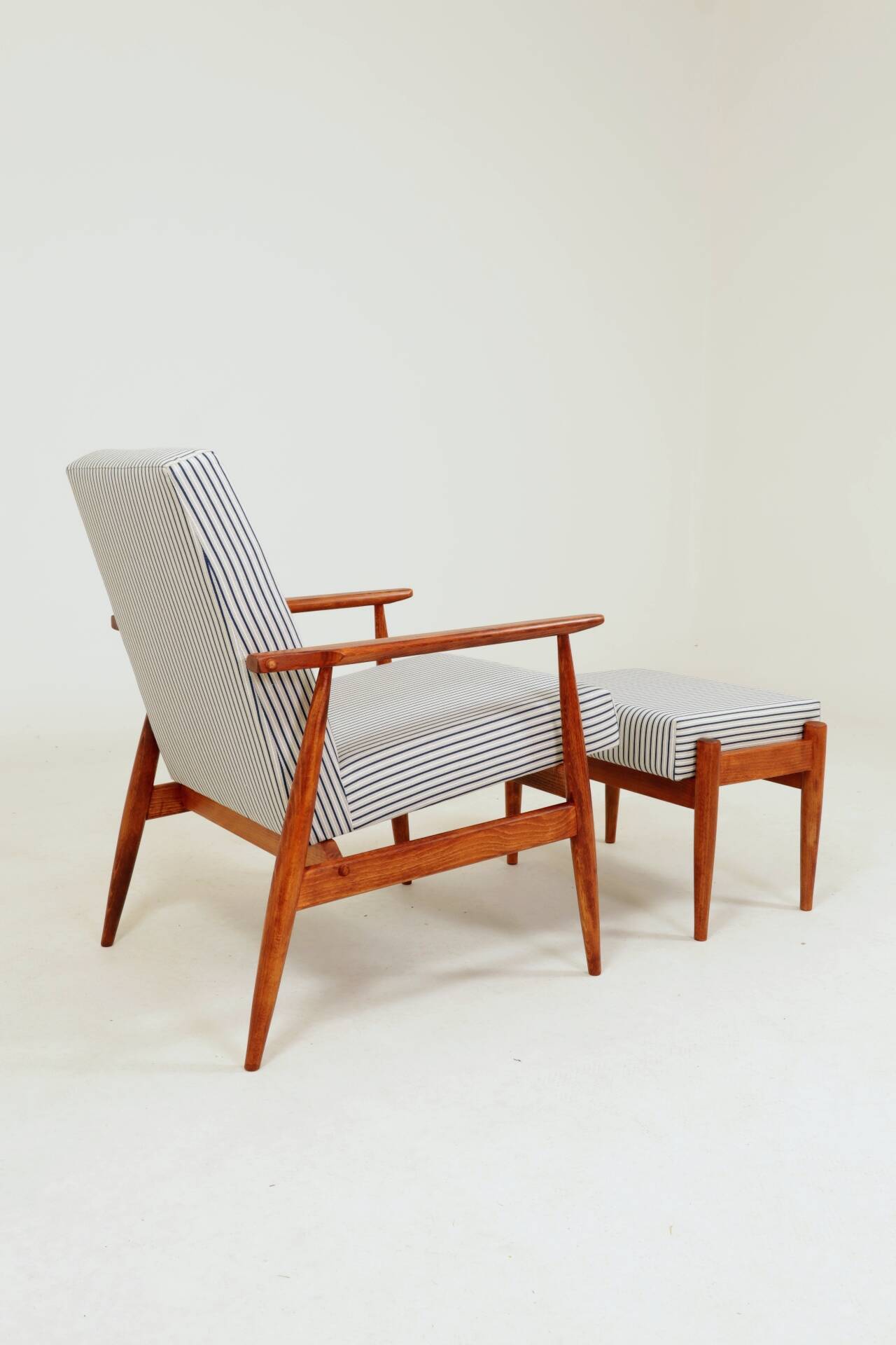 Armchair with striped fabric footrest, 1960