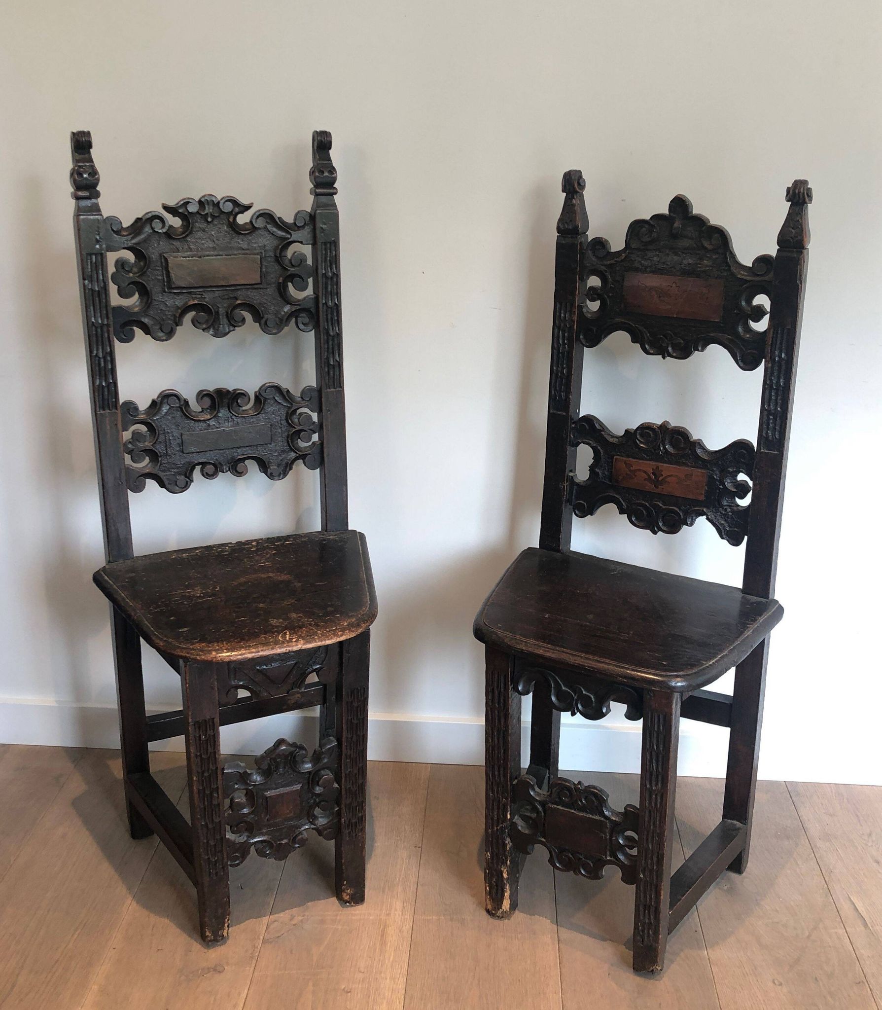 Set of an armchair and a pair of chairs in Italian Renaissance walnut