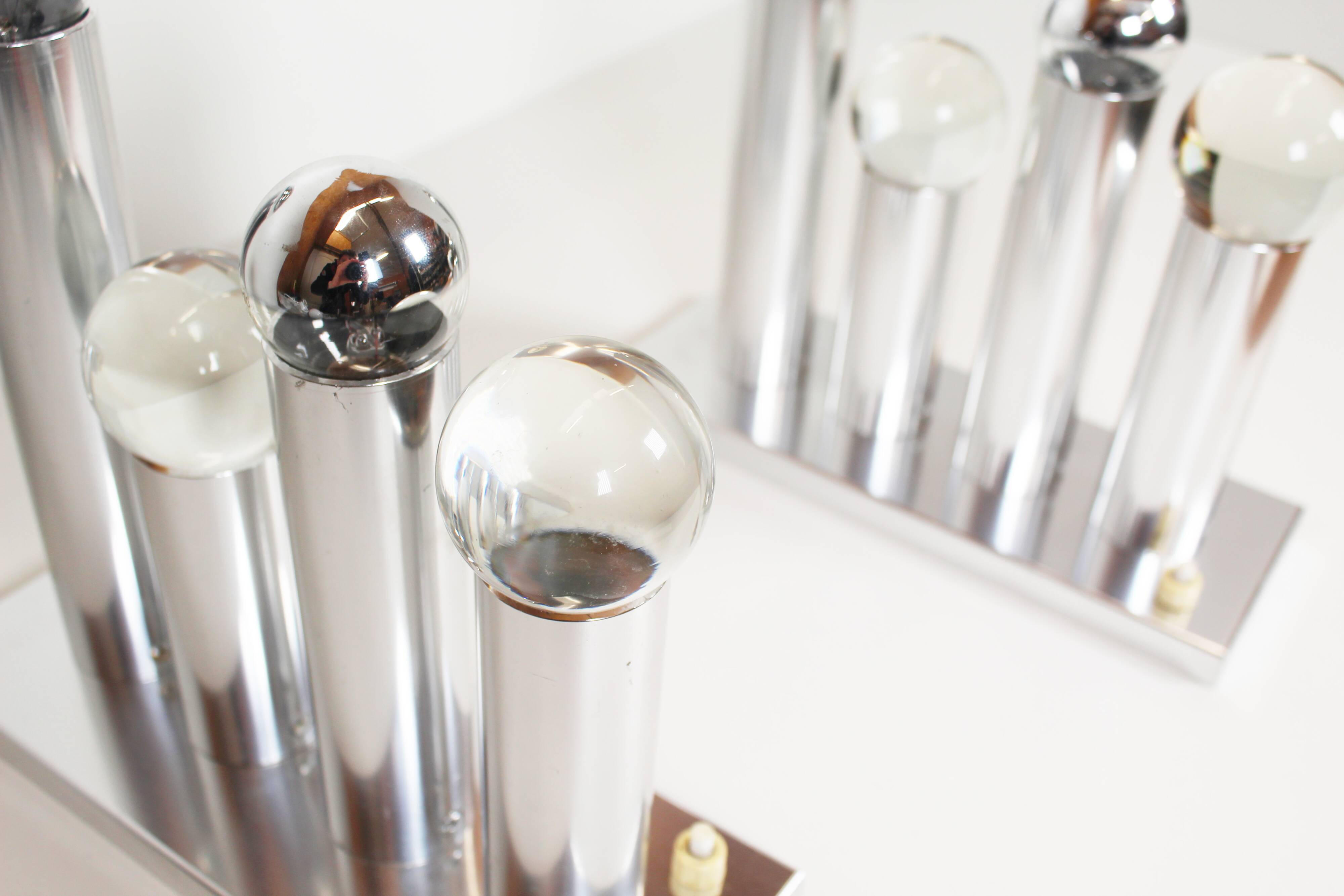 Pair of polished wall lamps by Gaetano Sciolari