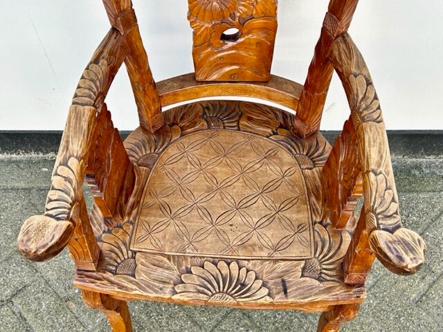 Hand stabbed teak armchair