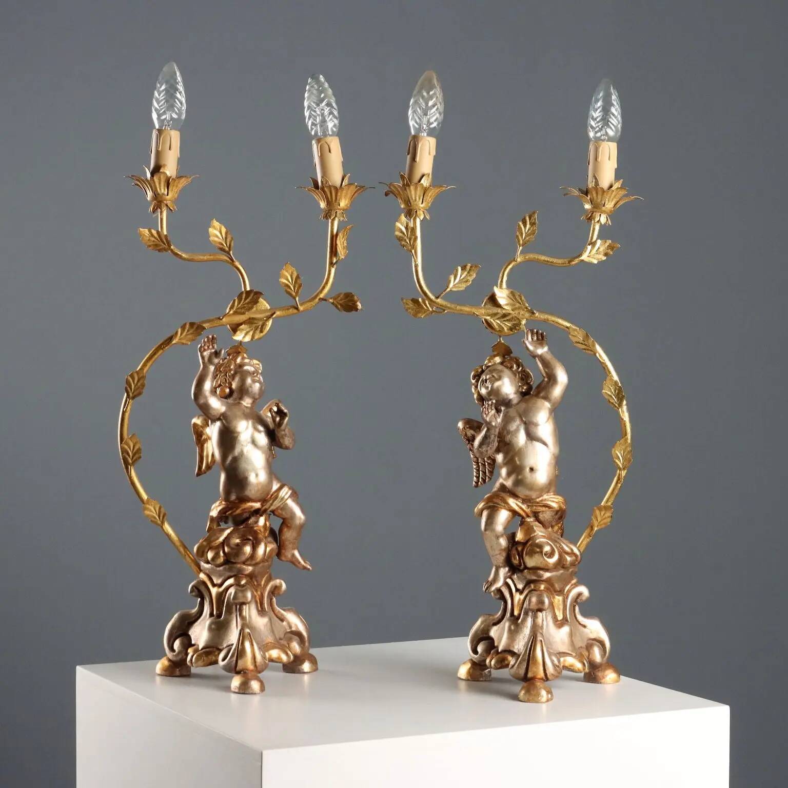 Pair of antique candelabra in carved and gilded wood, Italy, 20th century