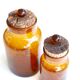 2 amber blown glass jars, cork stoppers