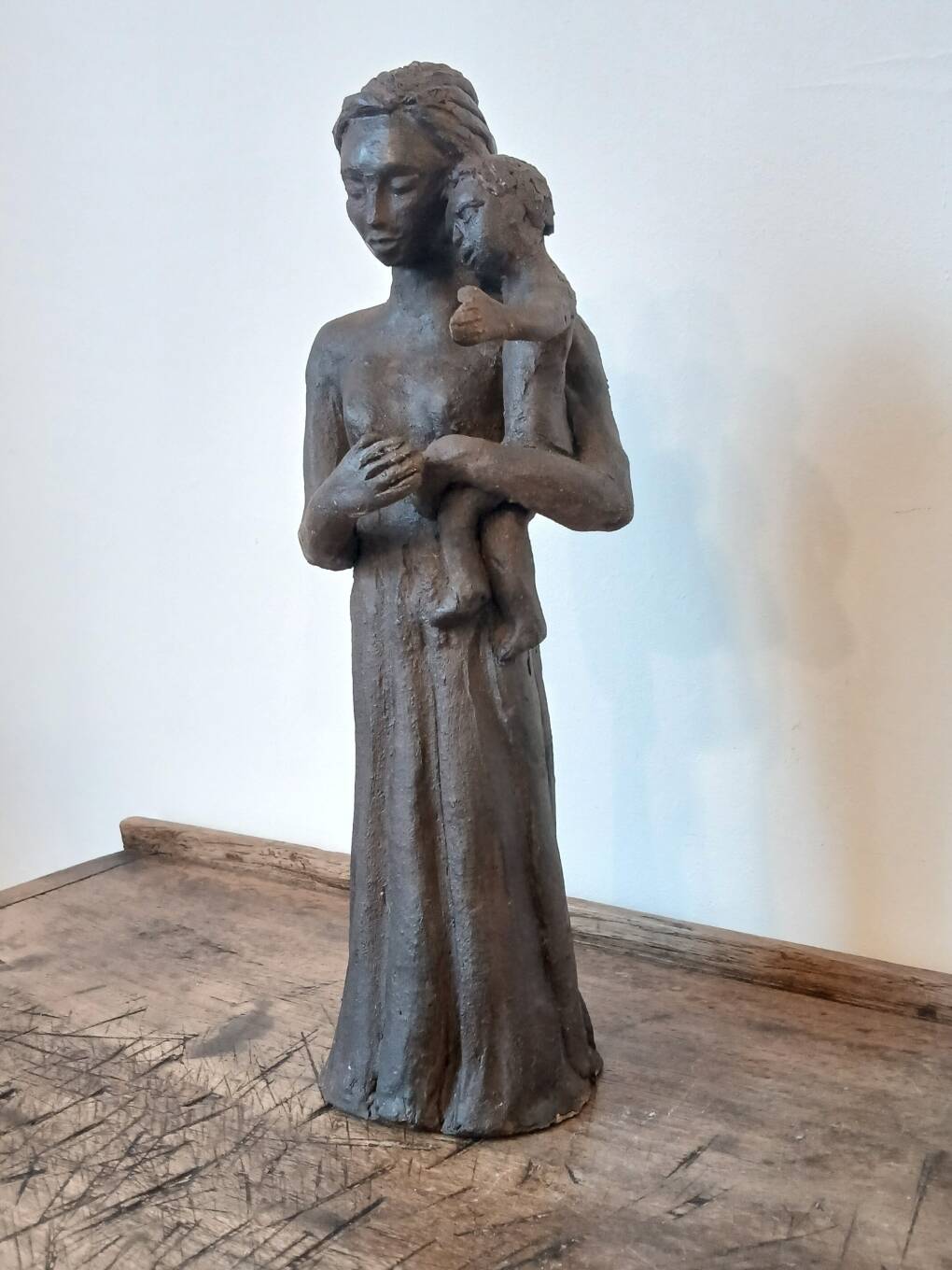 Sculpture representing a woman holding a child - original terracotta