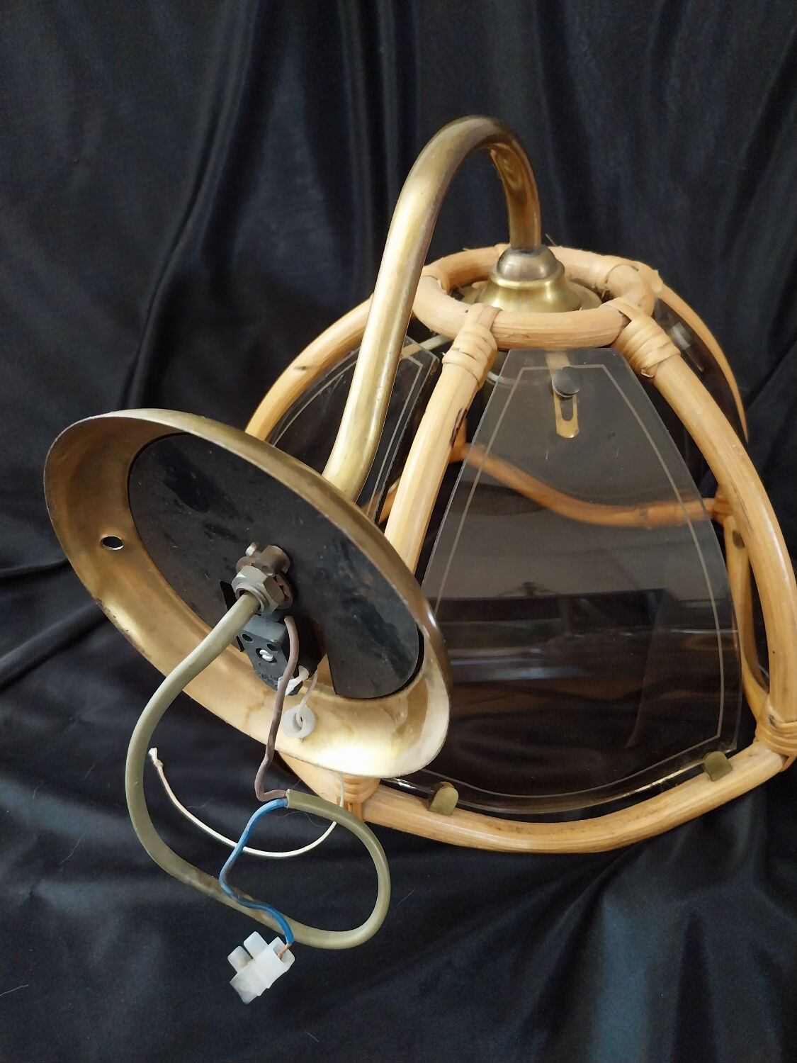 Wall sconces in rattan and smoked glass
