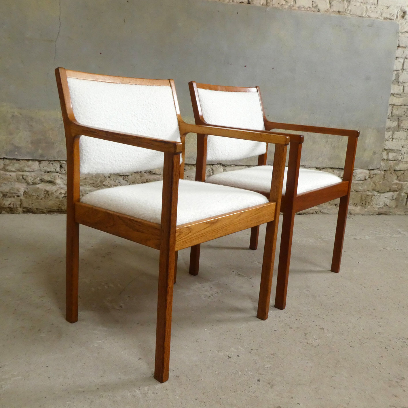 pair of Scandinavian teak armchairs and white buckles