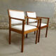 pair of Scandinavian teak armchairs and white buckles
