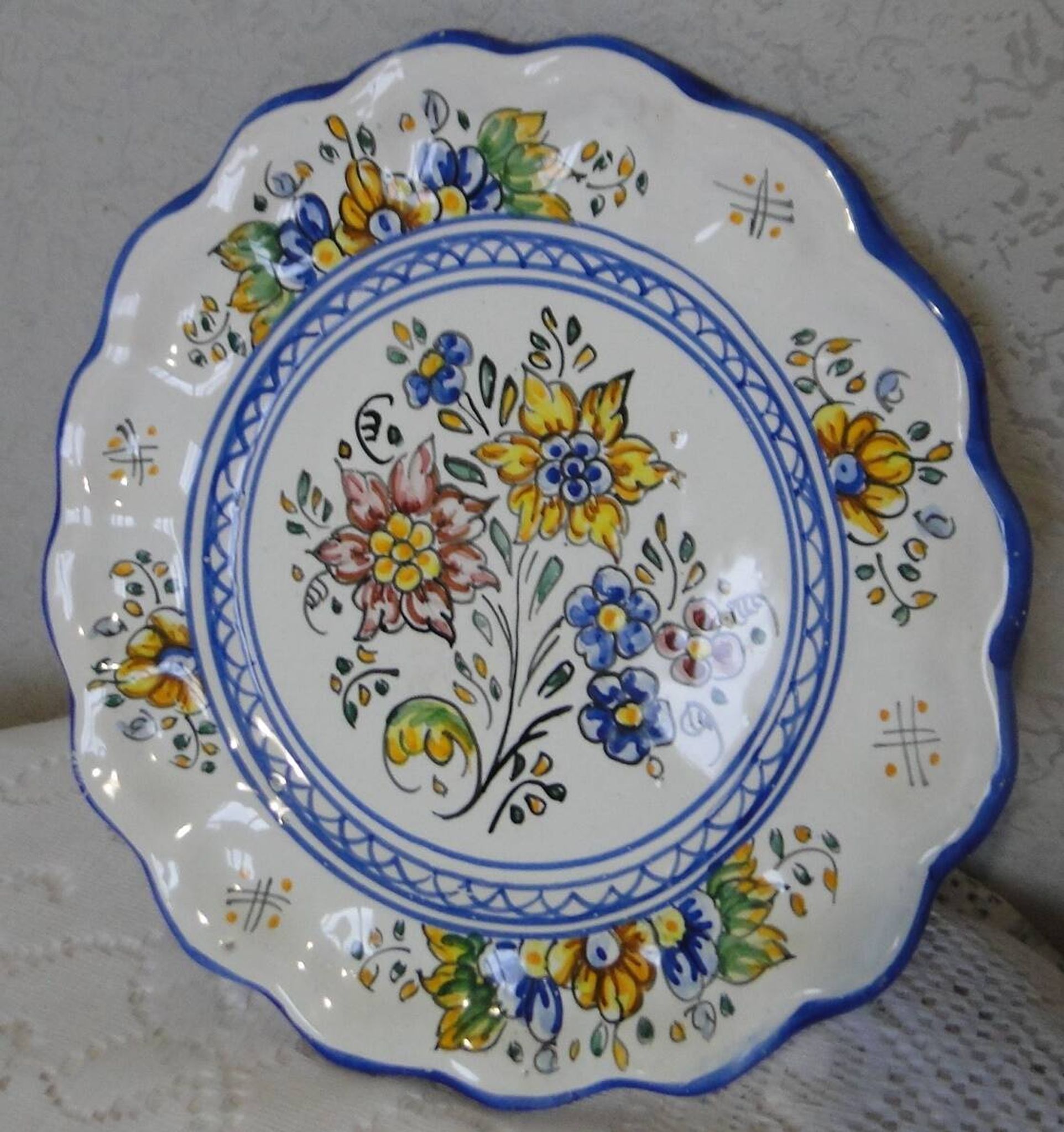Decorative earthenware plate with floral Talavera decoration