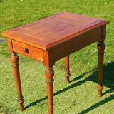 Antique solid wood table with a through drawer.
