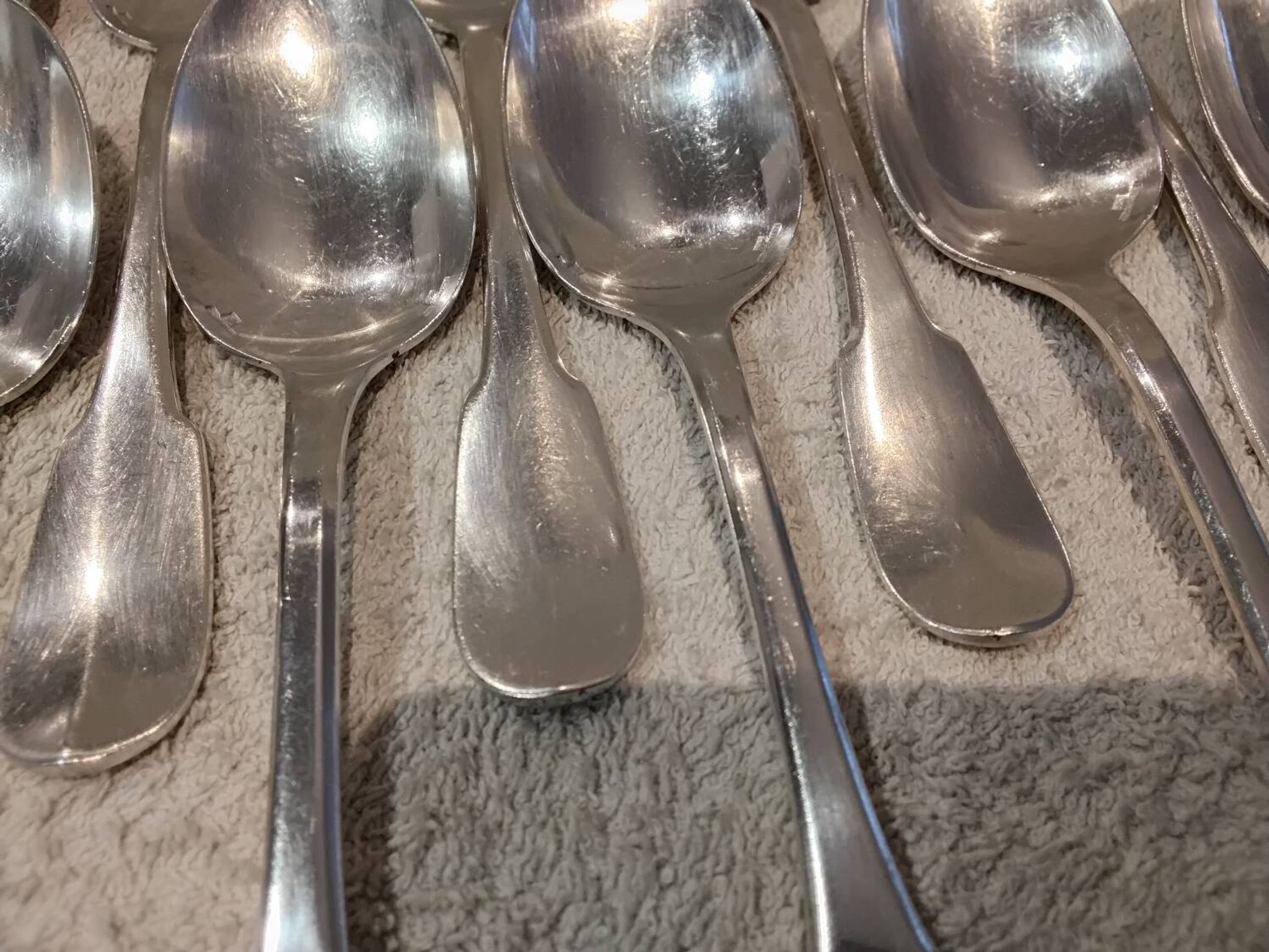 11 silver-plated dessert spoons by Christofle, Cluny pattern, striped