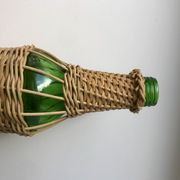 bouteille entourée de rotin années 70