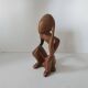 Wooden statuette sculpture of a thinking man design