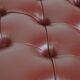 In very good condition elegant red/brown chesterfield ottoman made of cow leather