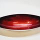 Designer bowl centerpiece in iridescent red enameled metal