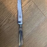 Knife with a forged steel bone handle