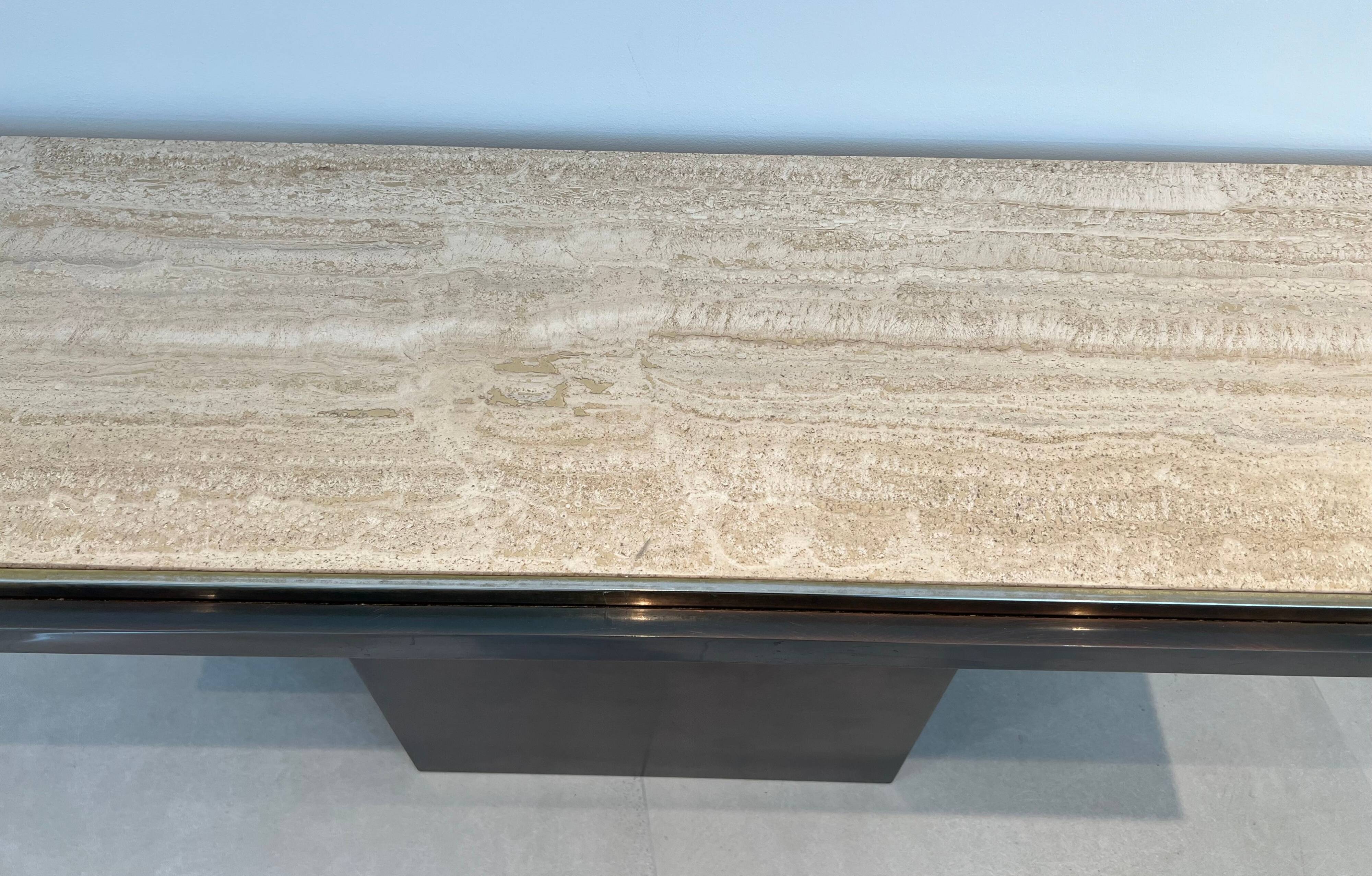 Console with a cannon-shaped travertine rifle stand. French work. Around 1970.