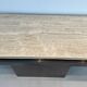 Console with a cannon-shaped travertine rifle stand. French work. Around 1970.