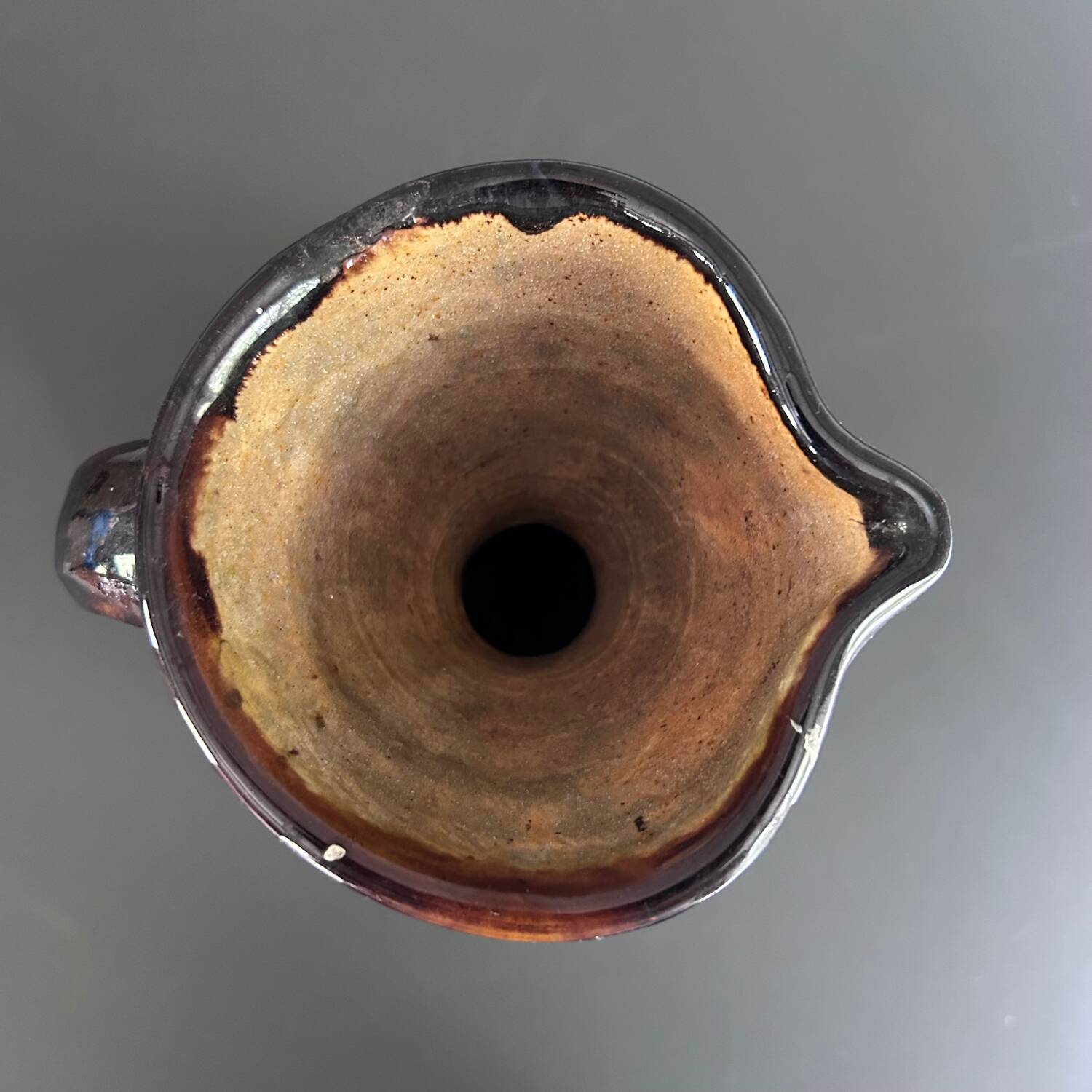 Black vase with yellow flowers