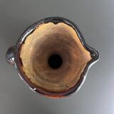 Black vase with yellow flowers