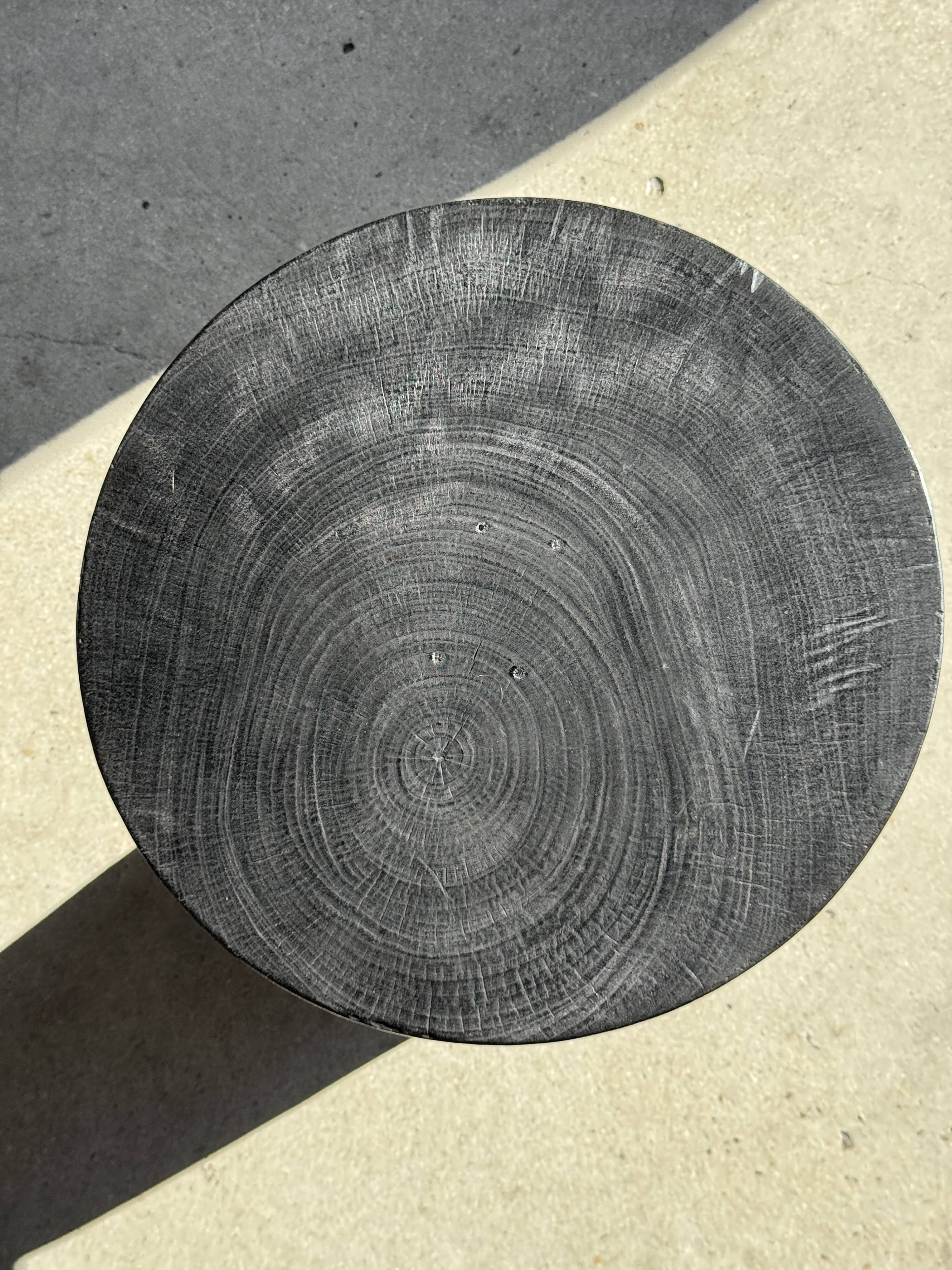 Black solid mango side table (monoxyle) with conical legs