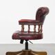 Fauteuil de bureau Chesterfield pivotant classique rouge en cuir de vachette sur roulettes