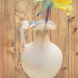 Old decorative carafe in li-colored glass
