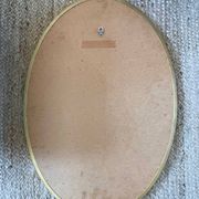 Oval mirror in carved wood