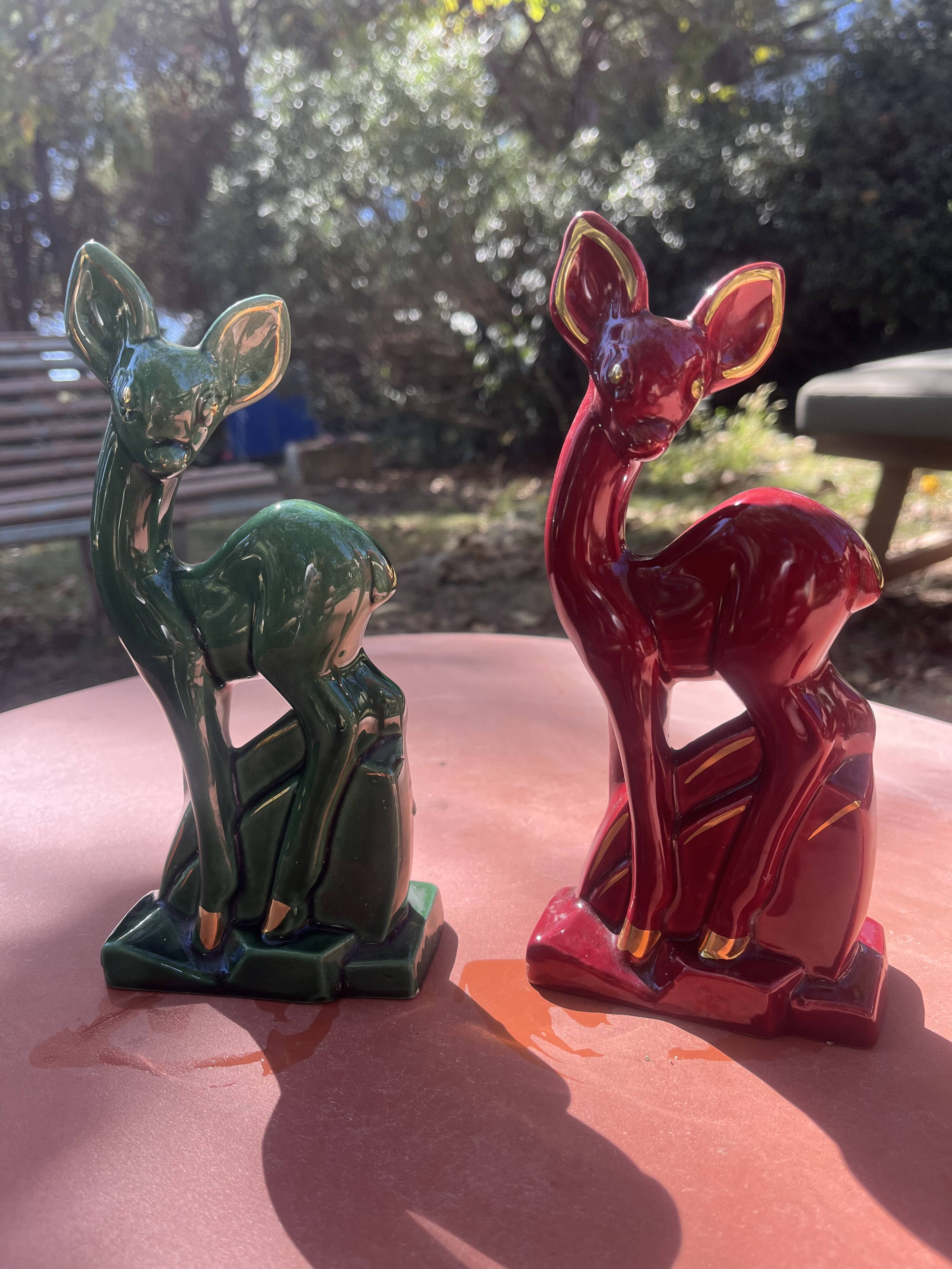 Pair of Art Deco deer by Charles Lemanceau in red and green ceramic.
