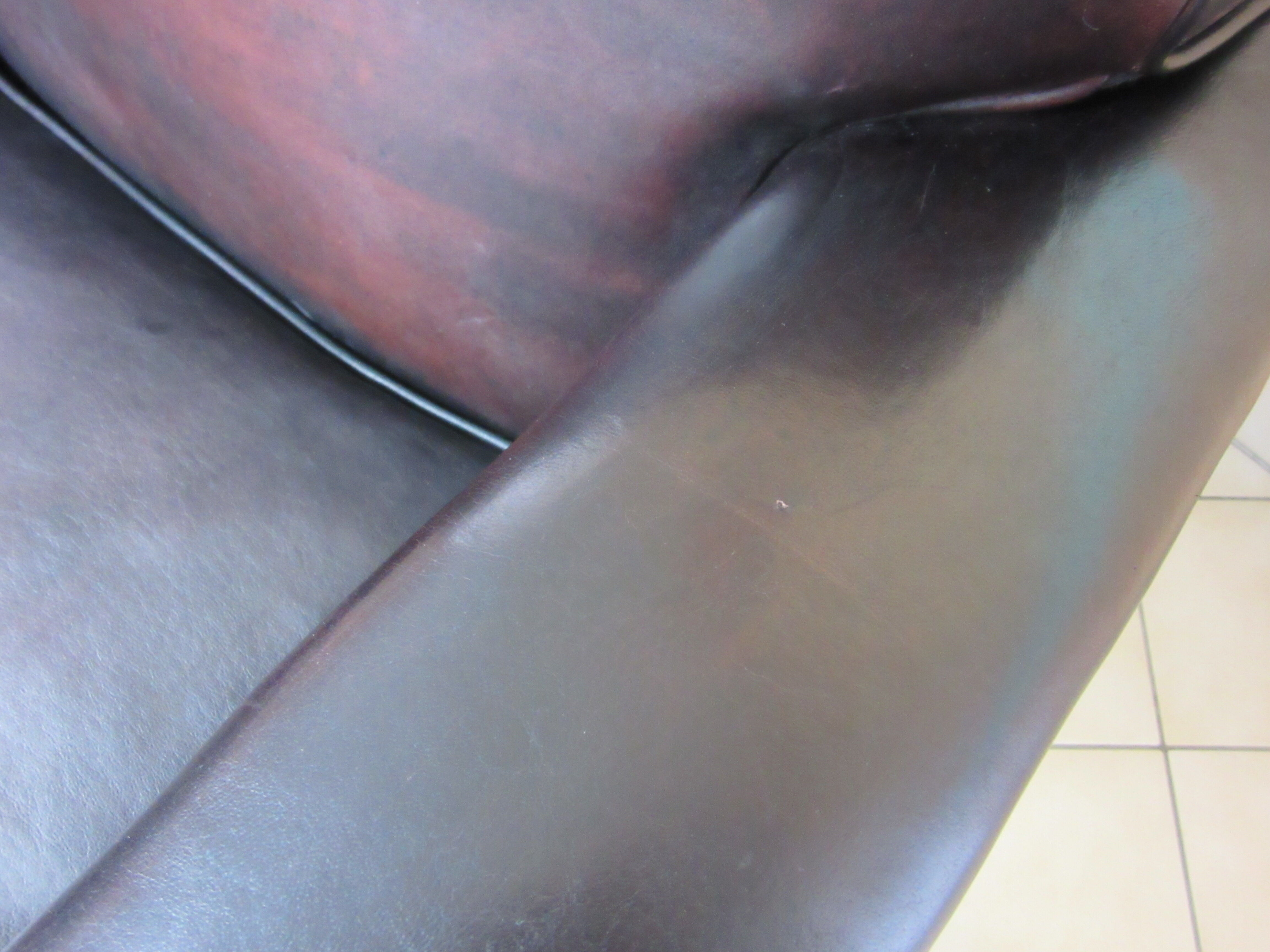 Fauteuil dandy ancien en cuir