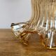 Gold bent wall light vintage tulip in amber glass.