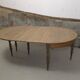 Half-moon extendable oak table for 2 to 8 people.