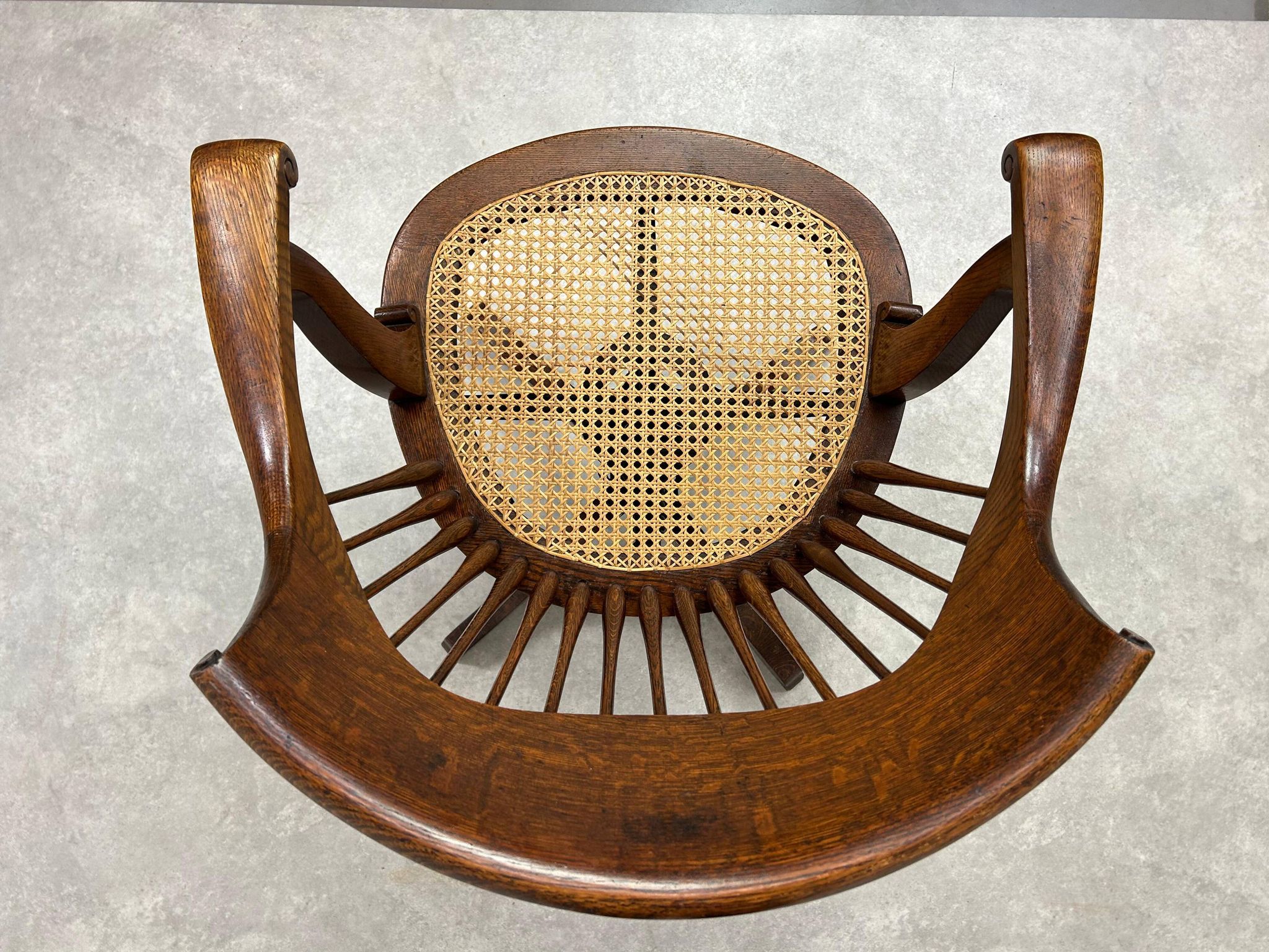 Swivel office chair in oak with a rattan seat.