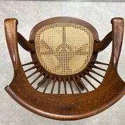 Swivel office chair in oak with a rattan seat.