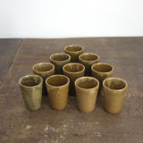 Lot of ten cups of Digoin sandstone