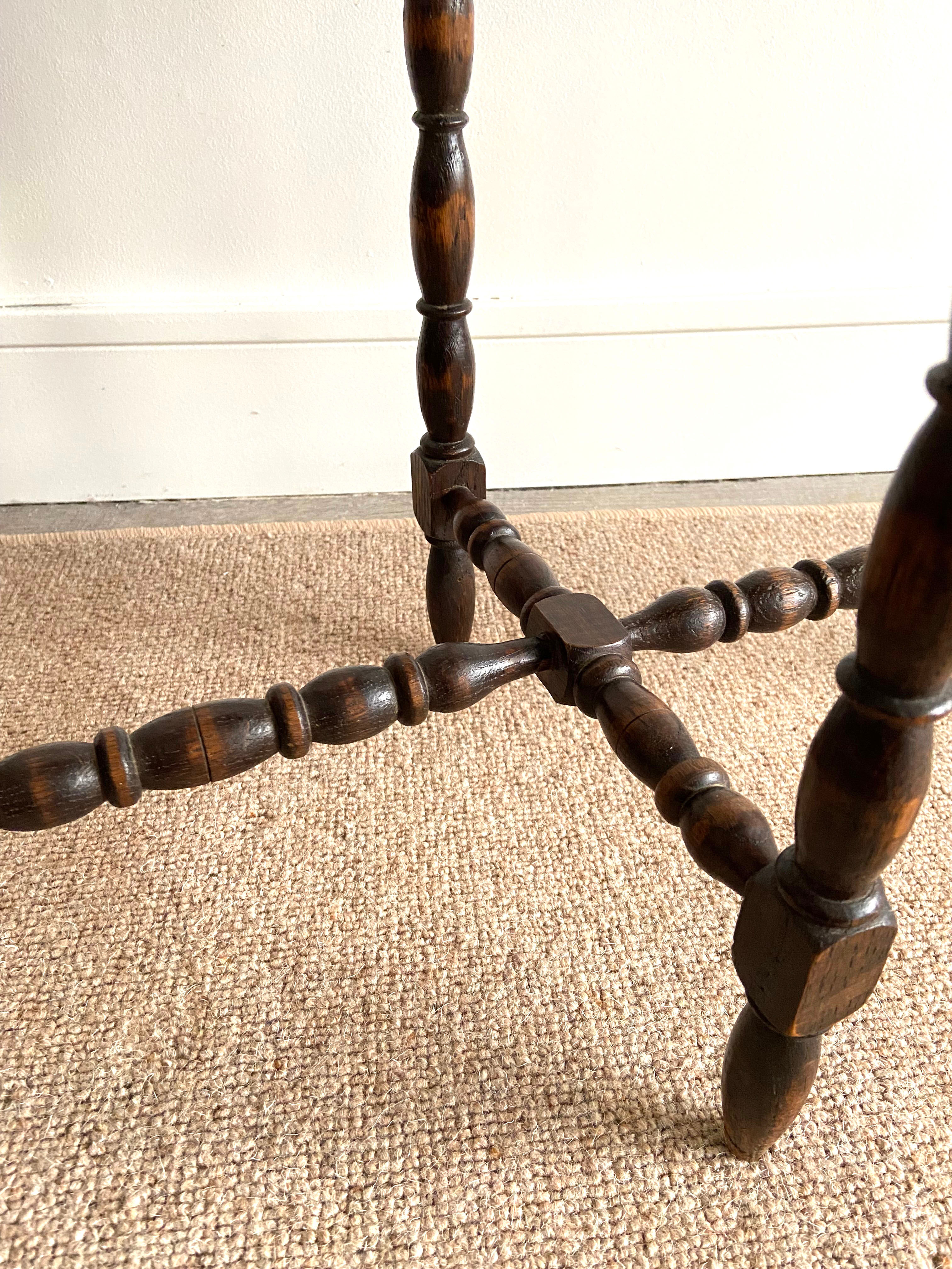 Oval wooden side table turned with spacer