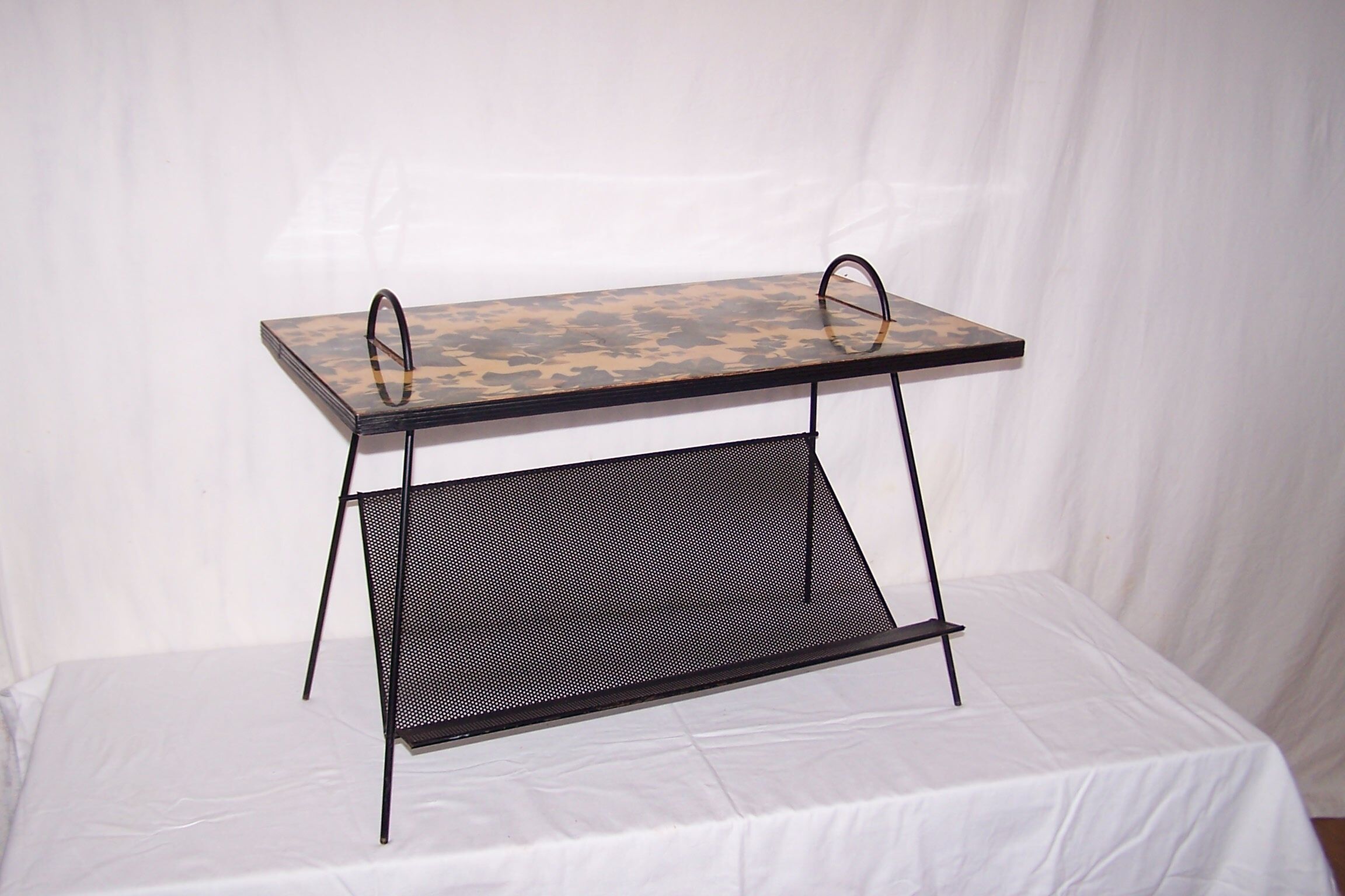 Perforated plate coffee table from the 1950s