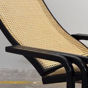 Rocking lounge chair, curved wood, leather, Viennese cane design.