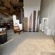 Rectangular Indonesian construction element with blue and yellow plant in carved wood