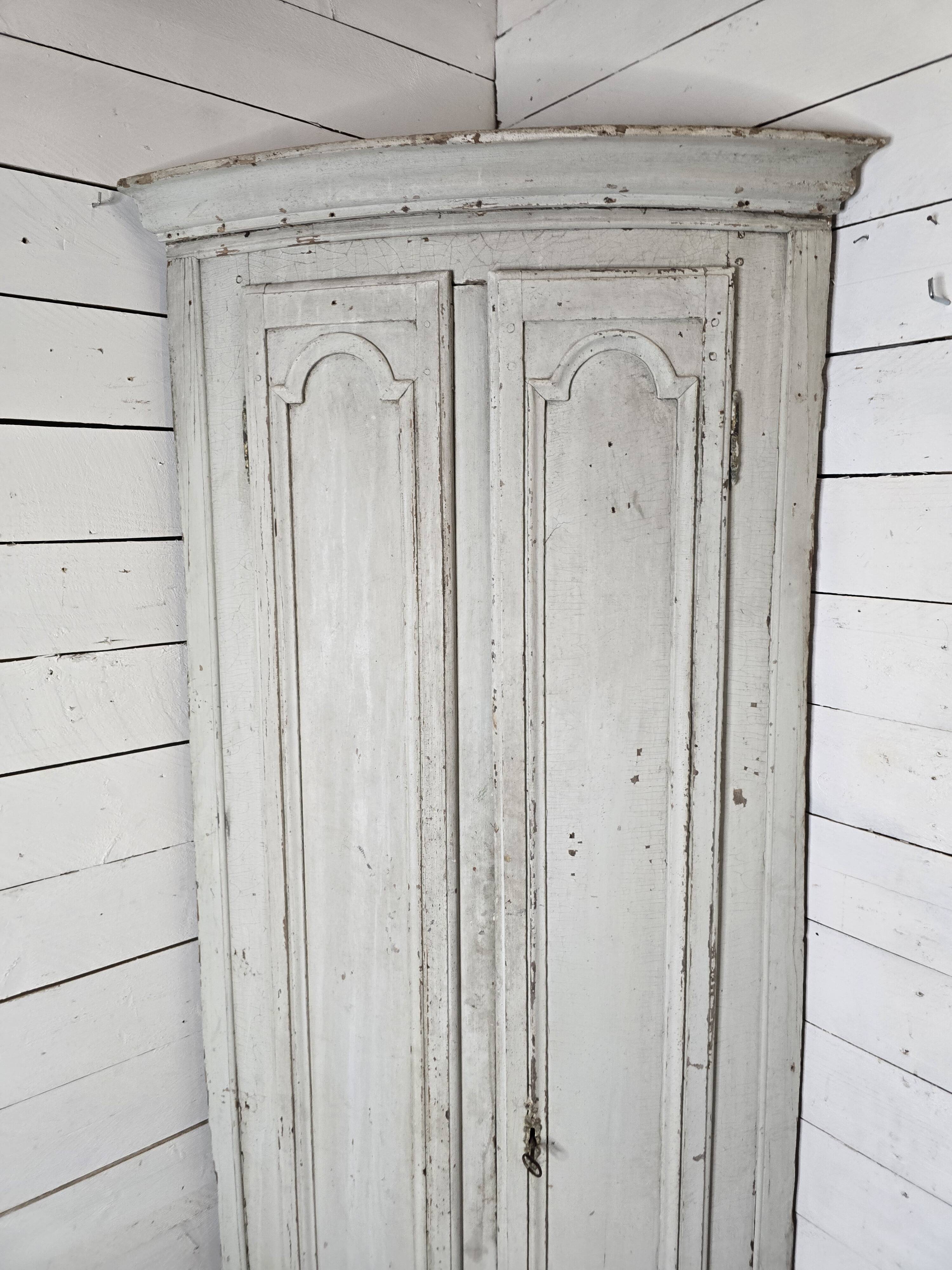 19th century curved corner cupboard in patinated oak