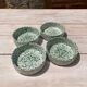 Four spotted green ramekins